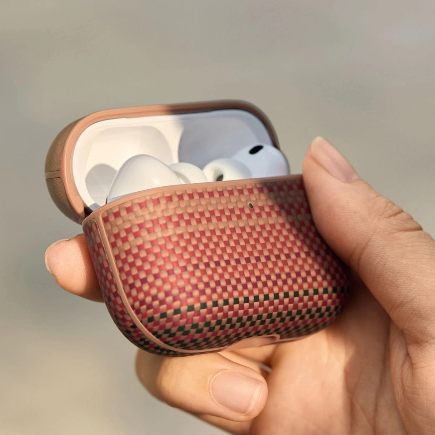 Hand holding an open MagEZ Case for AirPods Pro