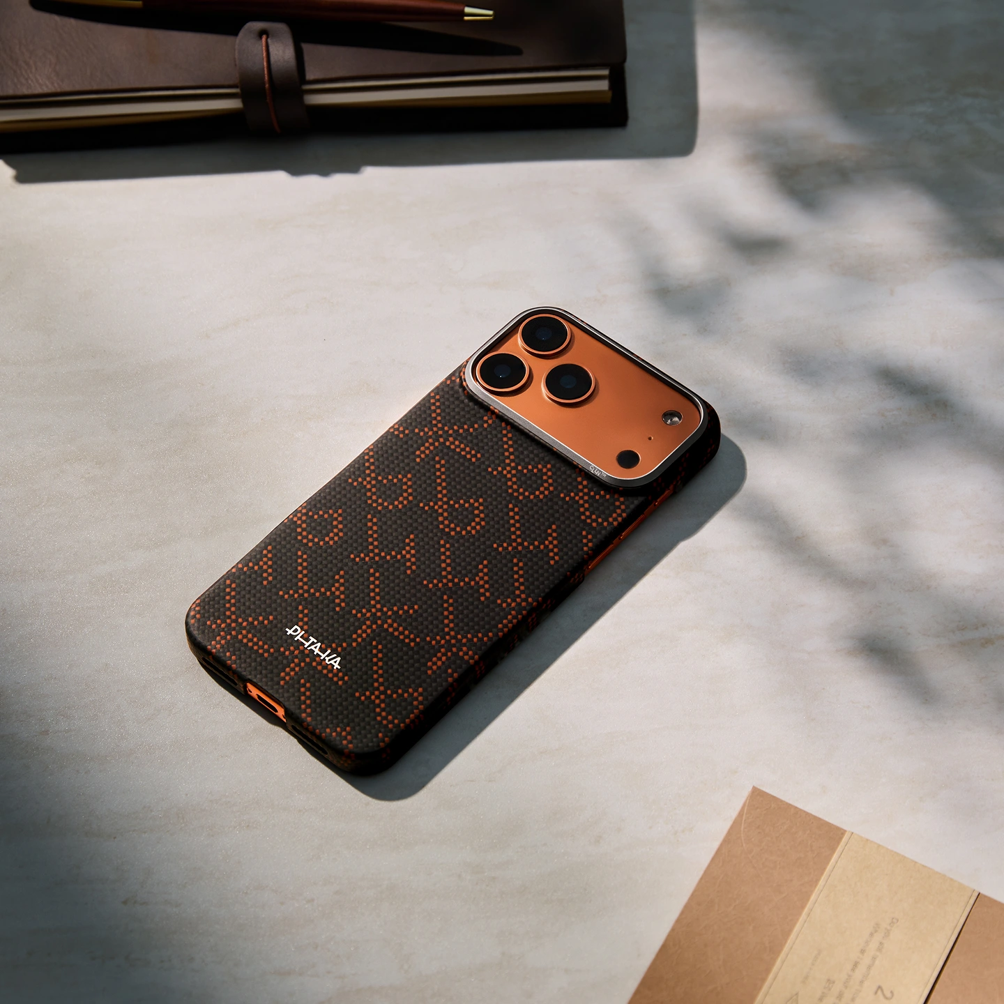 PITAKA Leaping Orange Black iPhone Edge Case lifestyle