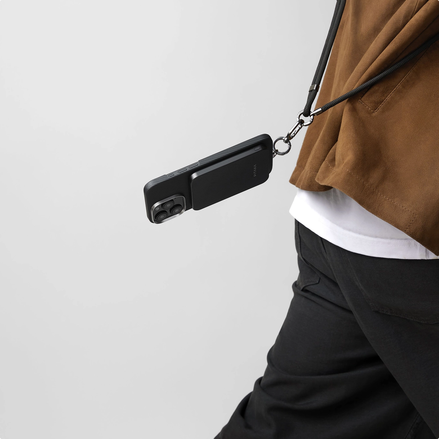 Magnetic power bank secured to a phone while moving